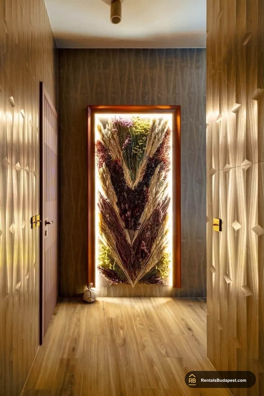 Corridor with backlit framed dried flower arrangement between textured wood wall panels, Akadémia utca