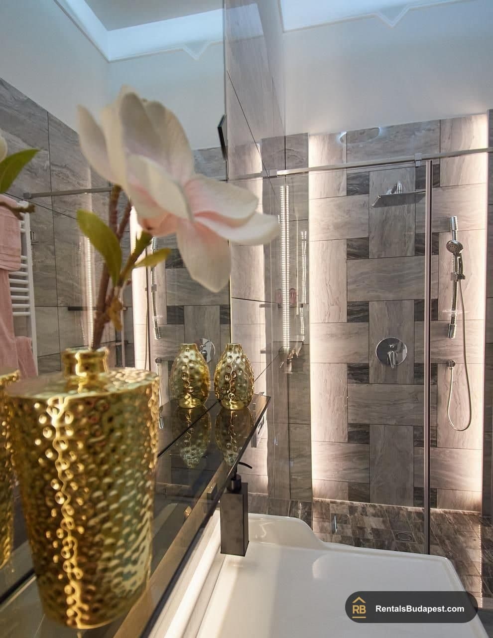 Bathroom detail with gold vase and glass shower enclosure, Szent István körút
