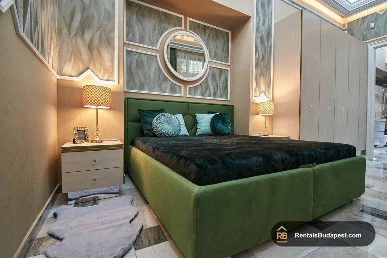 Bedroom with green upholstered bed, bedside tables and wardrobe, Szent István körút