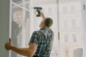 echnician repairing an apartment unit as part of property maintenance services