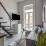 Compact studio gallery apartment for rent in Budapest on Akácfa Street with balcony and shared living area